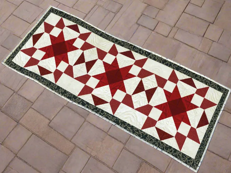 Boho Blanket Crimson Stars Quilt Pattern, a long narrow star quilt design