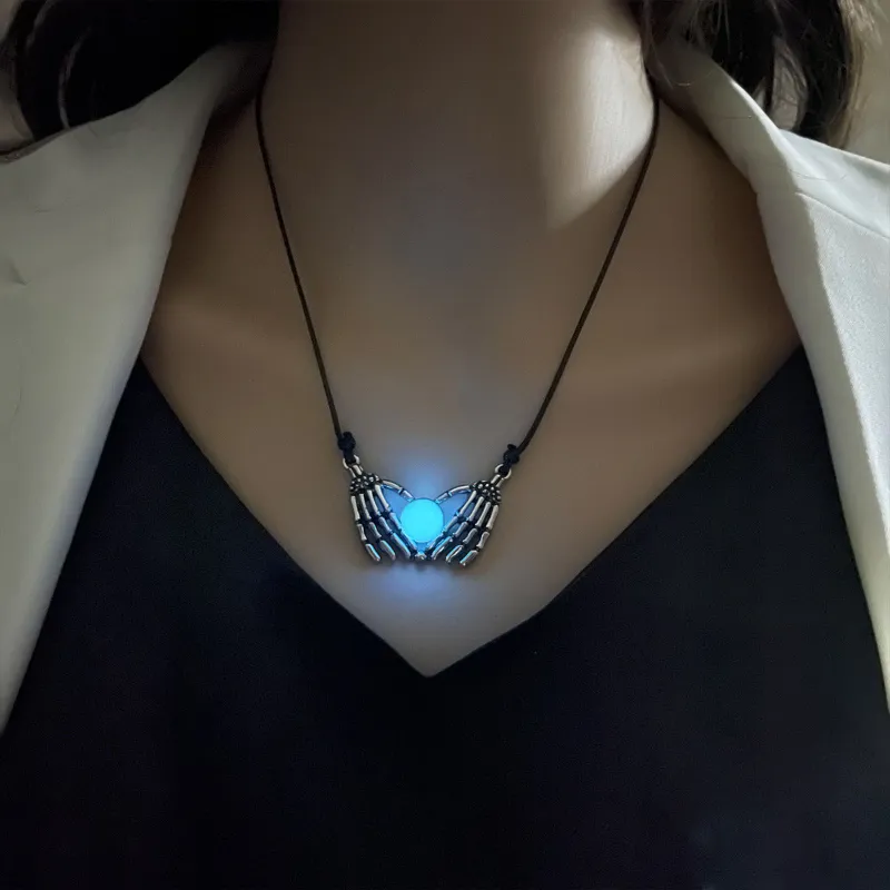 TTAesthetic Forever Love Skull Hands Glow Necklace showing glowing skull pendant