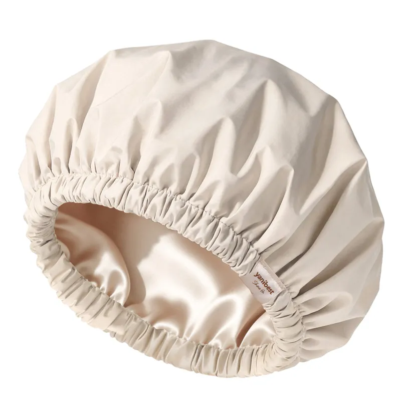 Yanibest Butter Satin Lined Waterproof Shower Cap in cream, elastic edge shown