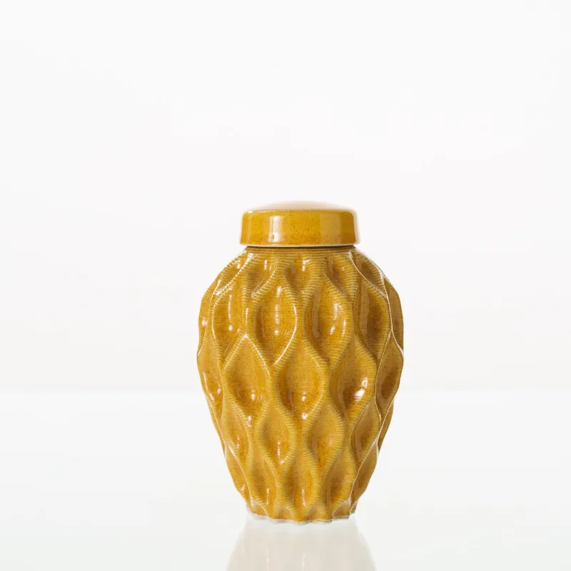 Pulvis Art Urns Echo 3D Printed Ceramic Urn in Amber Yellow, Keepsake size showing flowing sculptural surface texture