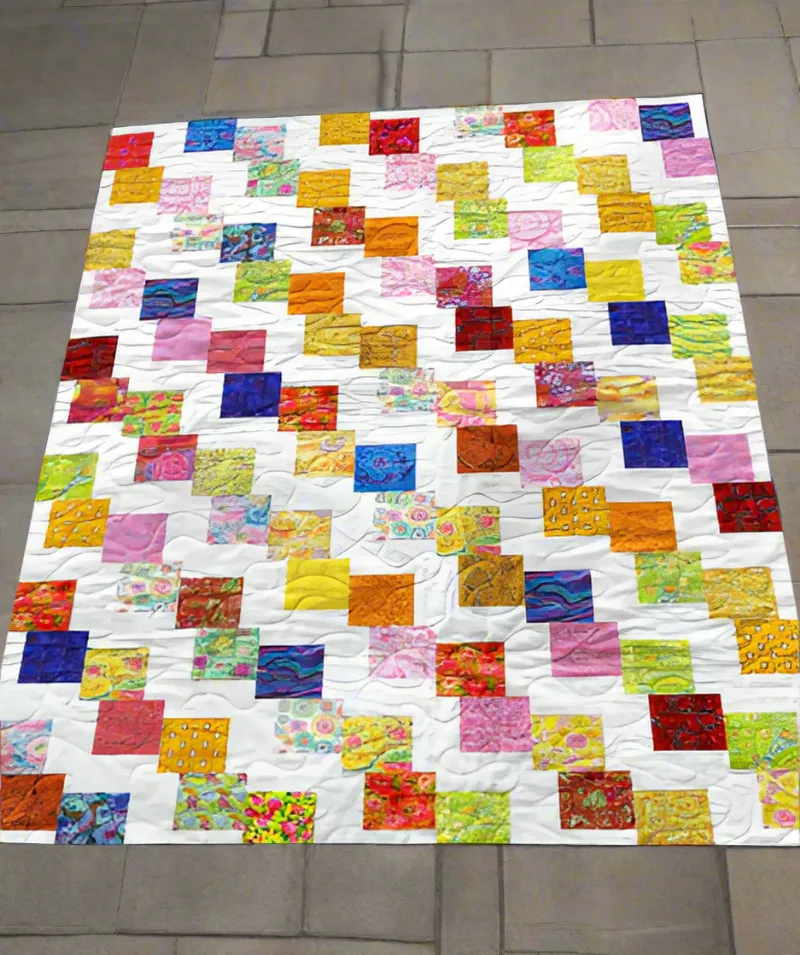 Boho Blanket Confetti Delight Quilt Pattern, a bold tree-ring quilt design in layered colors