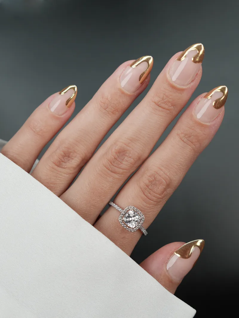 Roxy Nails Paris 24 karat press-on nails with nude base and flowing 3D gold design
