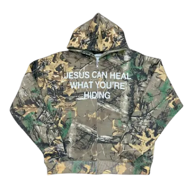 We The Believers Jesus Can Heal What You're Hiding Zip Up Hoodie in camo and black