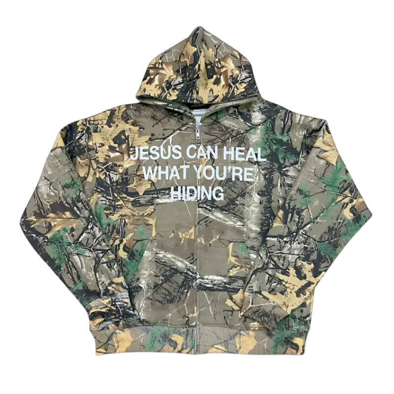 We The Believers Jesus Can Heal What You're Hiding Zip Up Hoodie in camo and black