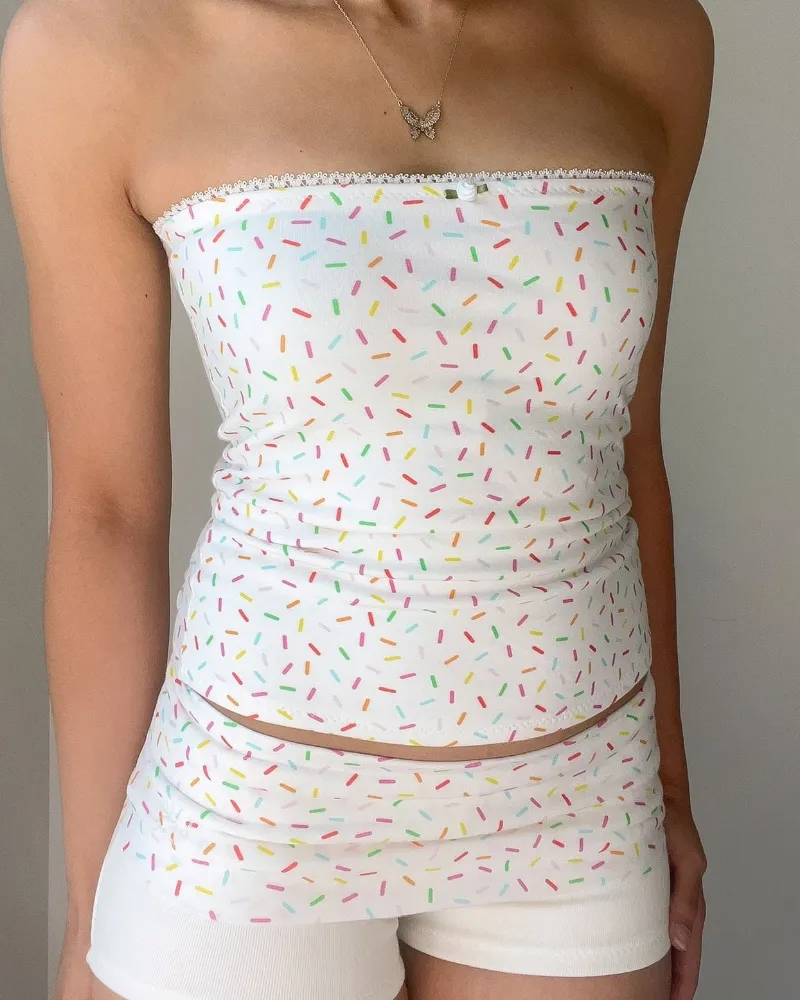 Bit By Angie Birthday girl tube top (Baby pink, White) showing a cotton sprinkle print tube top with rose detail