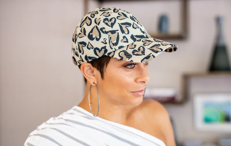 Embellished Leopard Hearts Cap with purple satin lining and heart-leopard print pattern