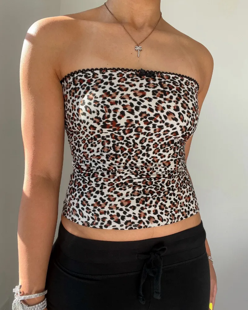 Bit By Angie Demi tube top in animal print with black elastic and mini bow