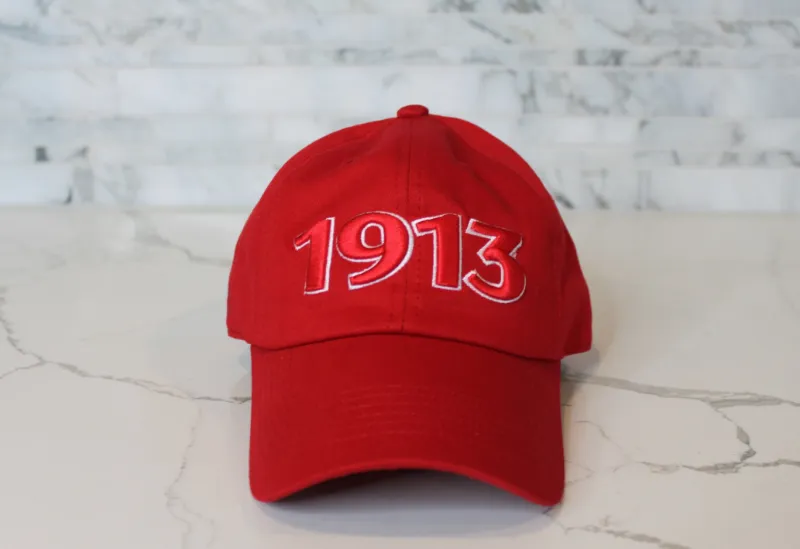 Embellished 1913 Cap in red cotton with red and white embroidered detail and curved brim