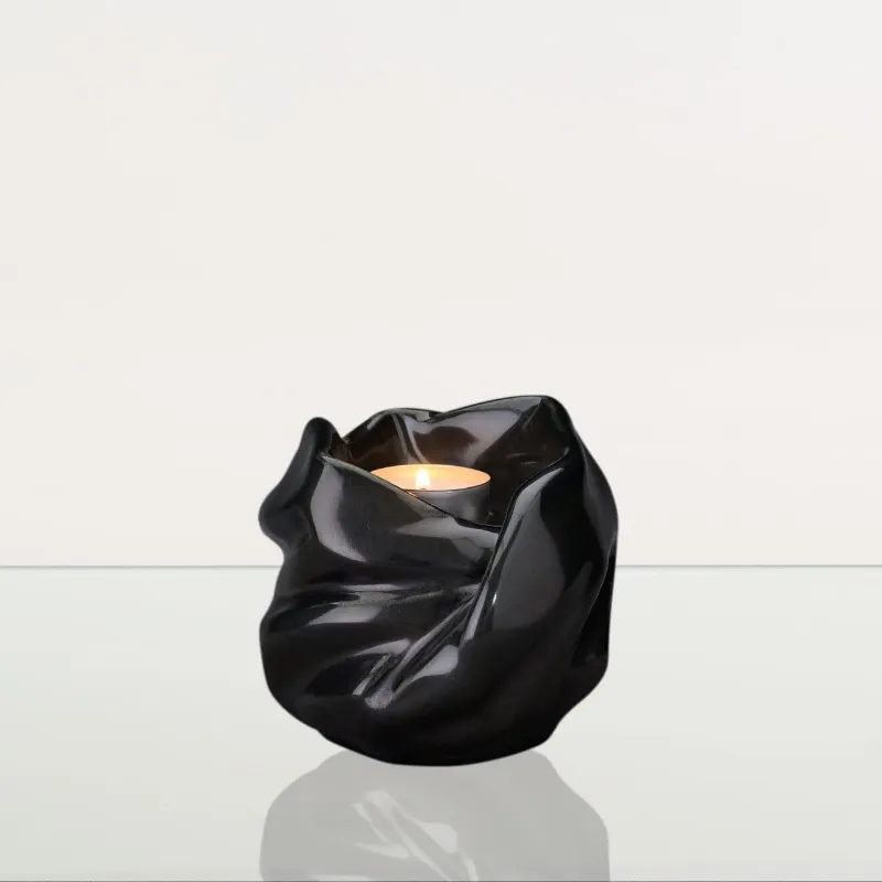 Pulvis Art Urns cremation keepsake urn in black gloss ceramic with integrated candle holder