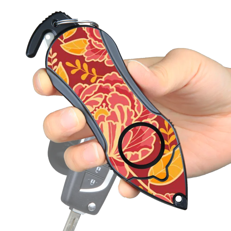 The Stinger Tools Stinger Personal Safety Alarm Keychain in Peony with siren, seatbelt cutter, and glass breaker