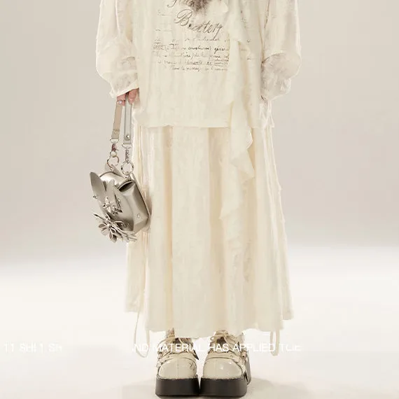 Juwas Beige Vintage Butterfly Print Skirt displaying a pleated midi garment hanging on a rack.