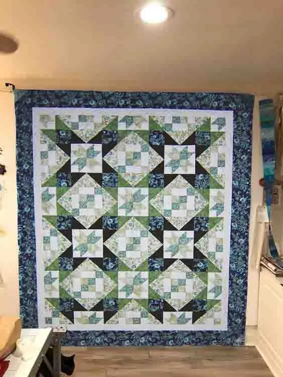 Boho Blanket Dublin Steps Quilt Pattern cover showing a bold graphic quilt with layered tree-ring design