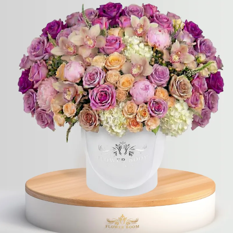 Flower Boom Dallas Flawless Violets arrangement with roses, peonies, and cymbidium orchids