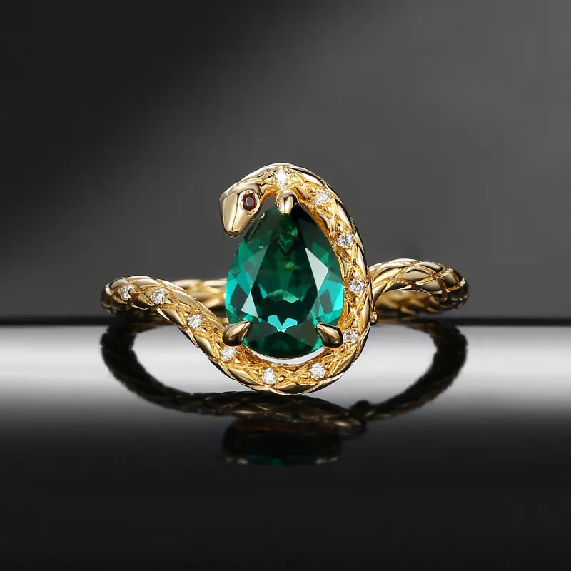 Starlandus Serpent's Embrace unique twist pear cut lab emerald engagement ring