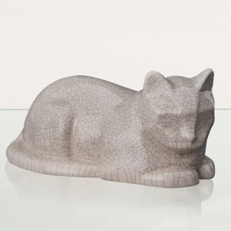 Pulvis Art Urns laying cat cremation urn in off white craquelure ceramic finish