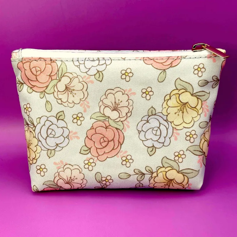 High Dreams Smell Proof Bag Floral, pink and blue floral bag with gold zipper and odor-blocking lining