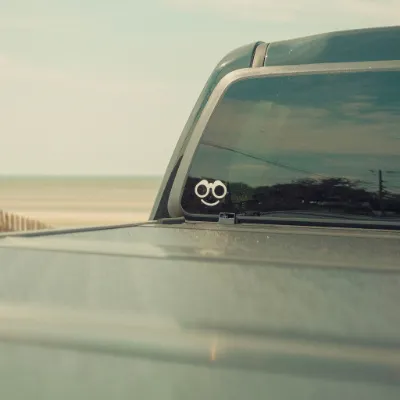 Find The Good Brand In Search Decal showing white binoculars icon with smile design