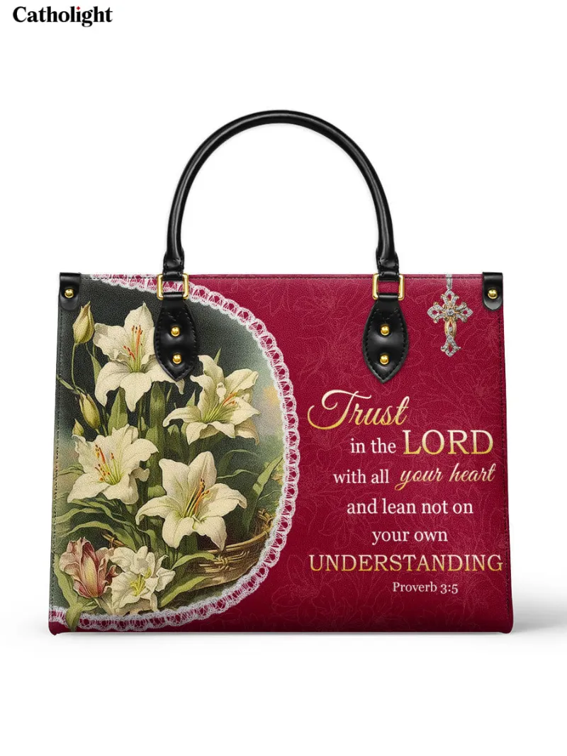 Catholight Lilies of Faith Leather Bag with Proverbs 3:5 verse and white lilies on crimson background
