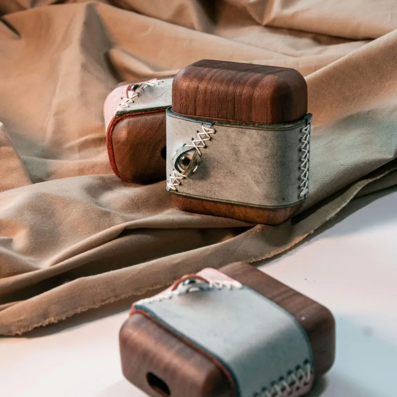 Techypop Stitched Eye Leather Dark Wooden AirPods Pro case with eye design detail