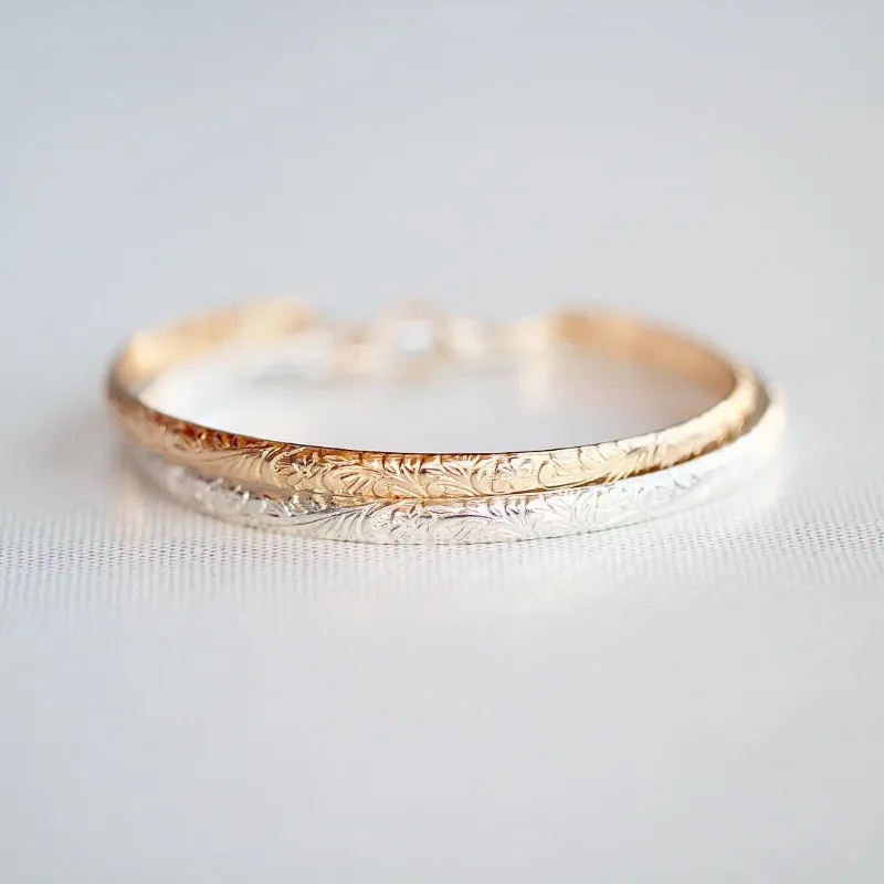 Spirit Nest Blossom Floral Bangle with engraved botanical pattern and hook clasp