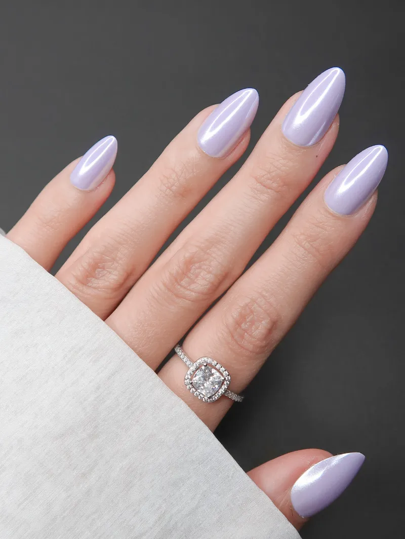 Roxy Nails Paris Lilac glow press-on nails in pastel violet with pearlescent chrome finish, almond shape