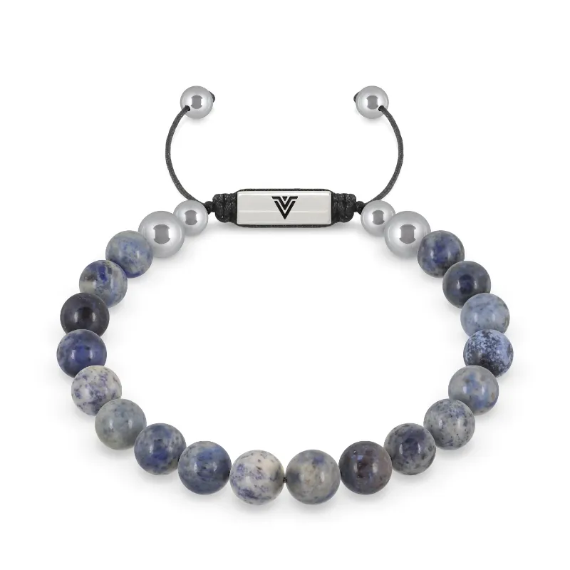 VOLTLIN Dumortierite Shambala Bracelet on a black suede pouch showing blue-gray stone beads