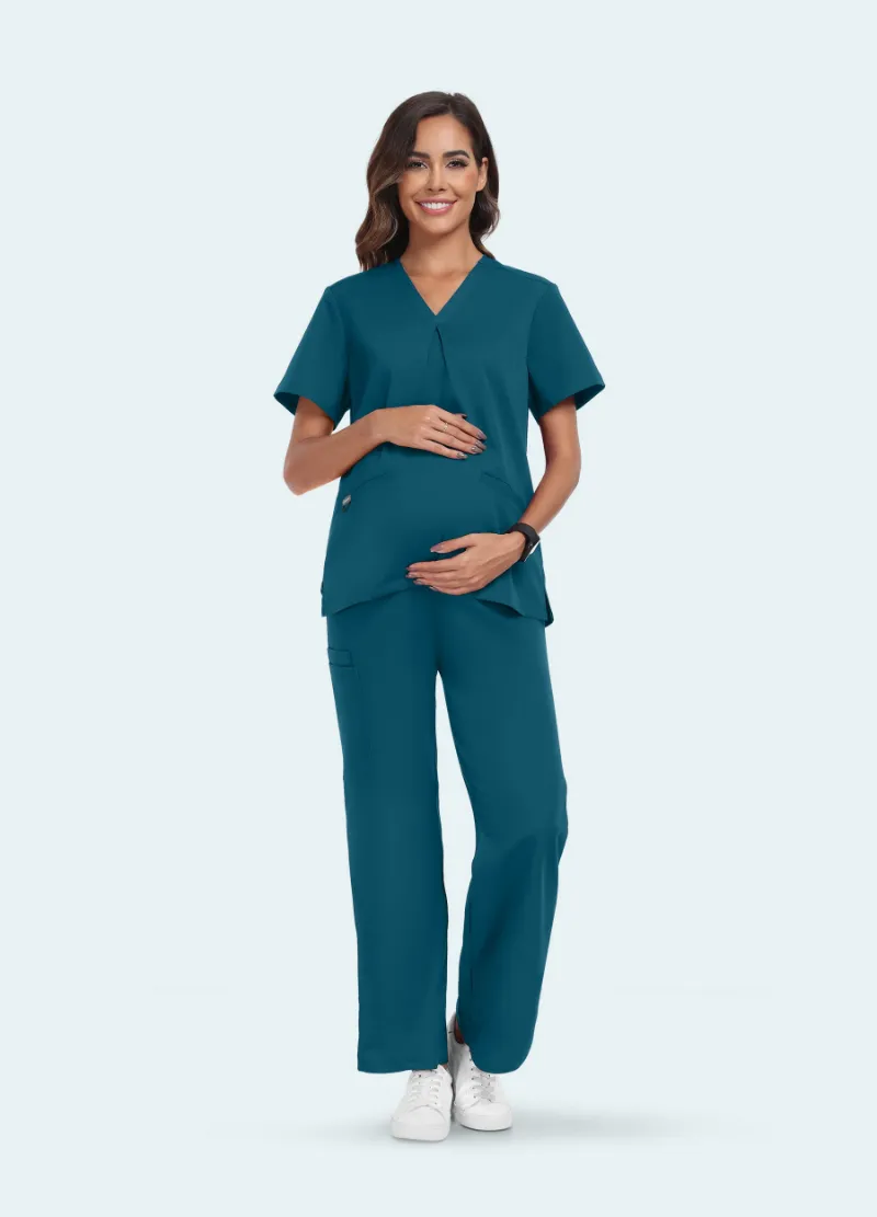 COMENII SoftTouch Maternity Scrub Set in Caribbean Blue, front view showing adjustable waistband and cross-pleat top
