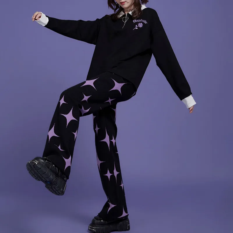 Juwas Black Purple Star Knitted Pants showing the textured knit surface and scattered star accents.