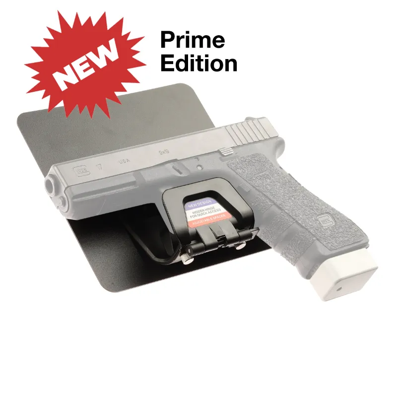 The Stinger Tools Stinger Prime Magnetic Gun Mount with sticky pad, shown mounted on a flat surface