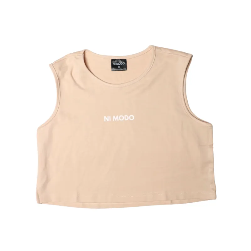 Nimodo Training Crop Top in Sandy Beige with Ni Modo text on front