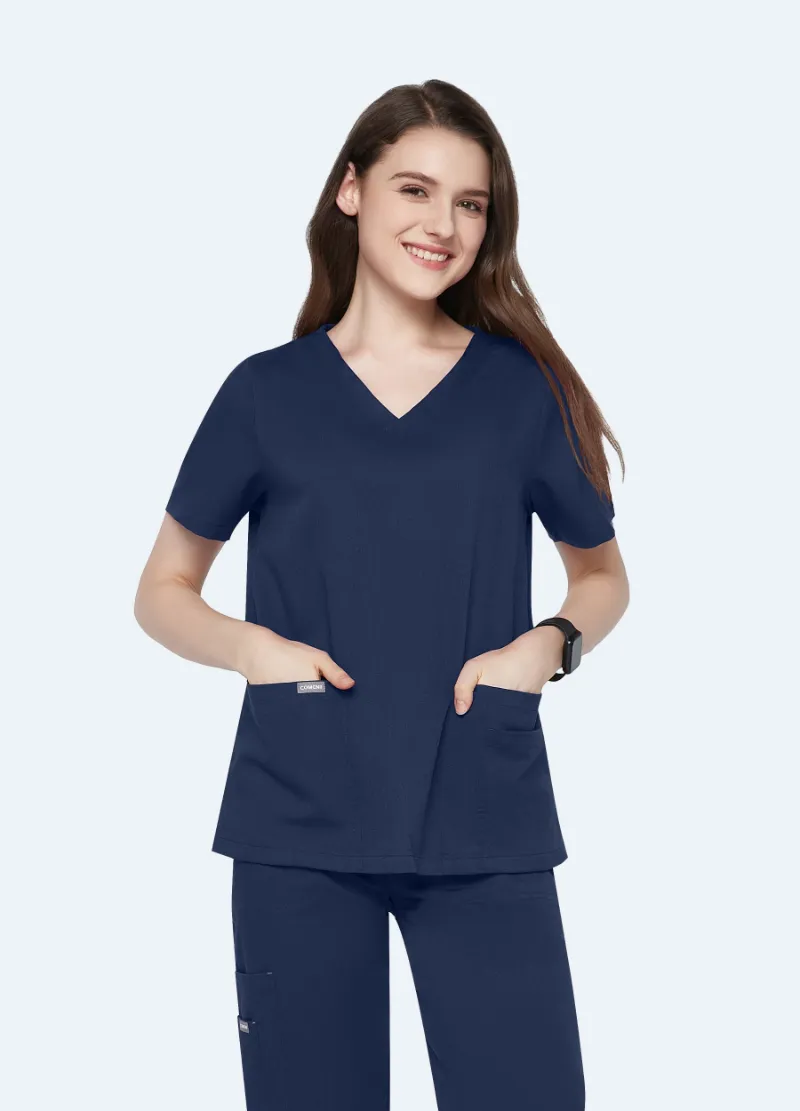 COMENII ElegCare Essential Scrub Top Navy showing V-neck, sleeve pocket, and welt pockets