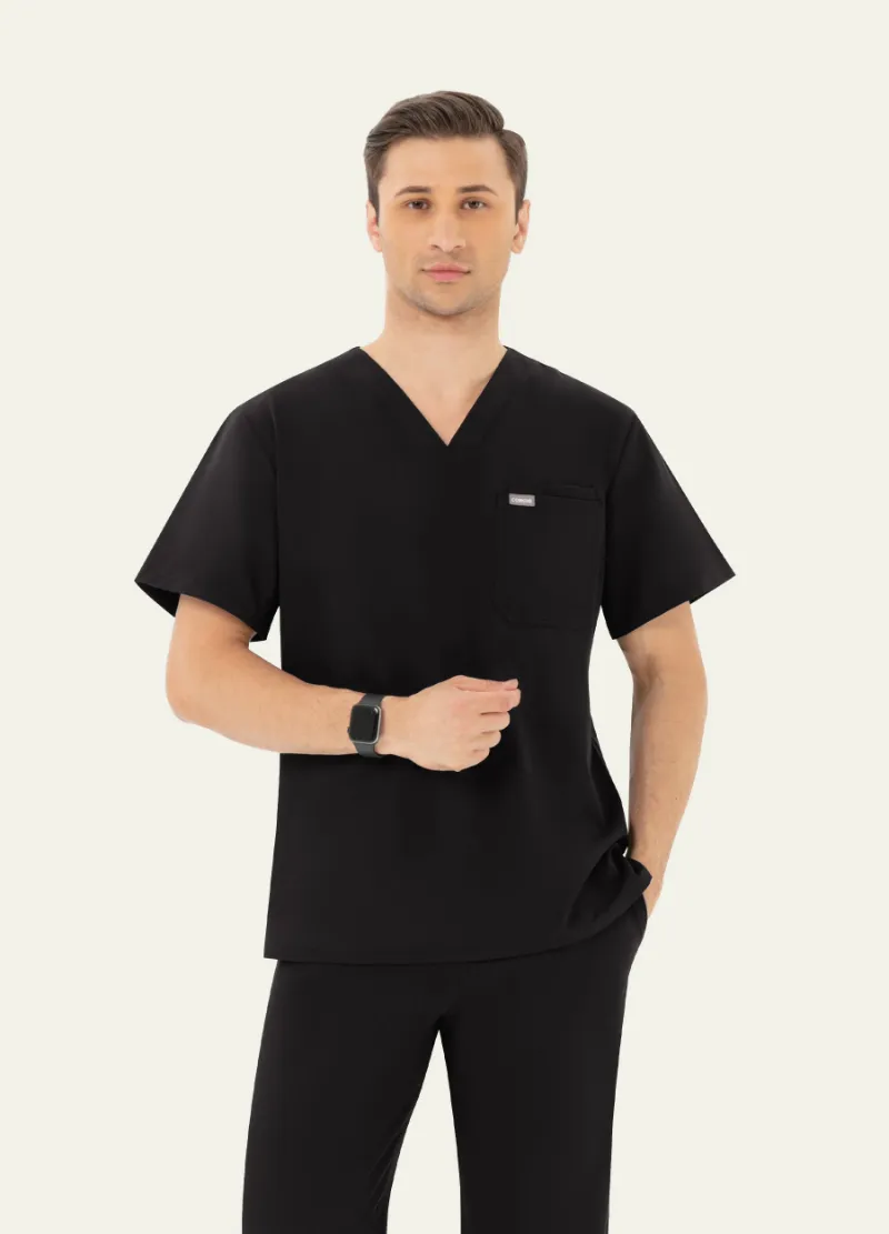 COMENII DynaComfort Essential Scrub Top Black, V-neck silhouette showing chest pockets and soft fabric detail