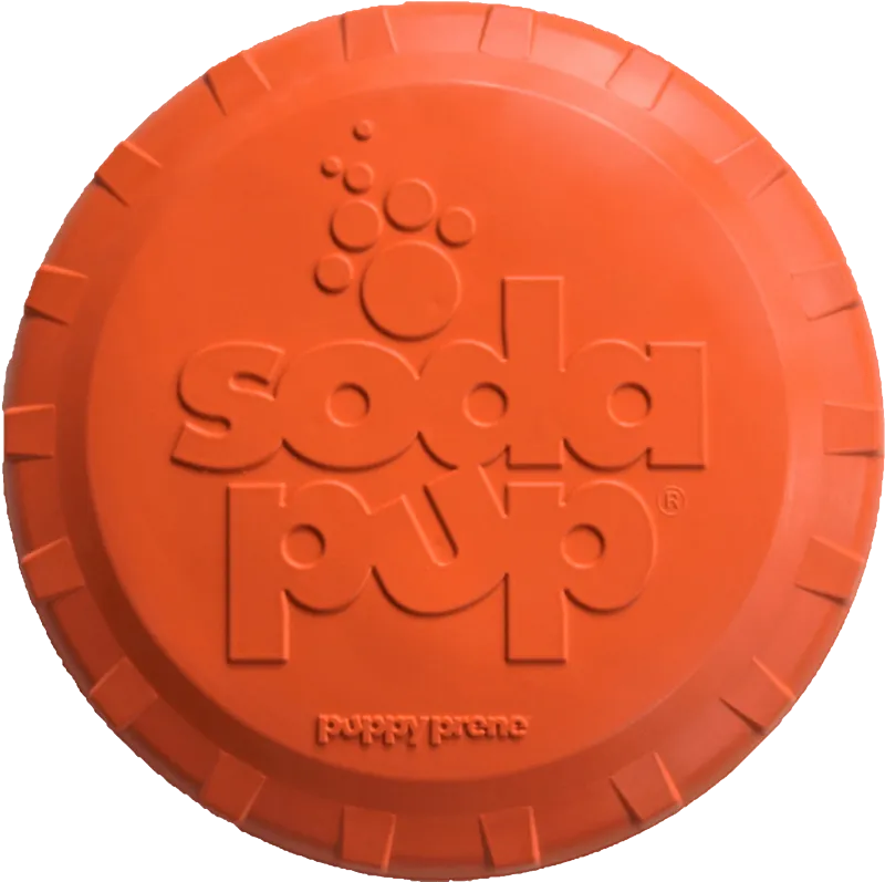 Soda Pup Bottle Top Flyer Rubber Frisbee for Dogs - orange rubber frisbee dog toy on grass