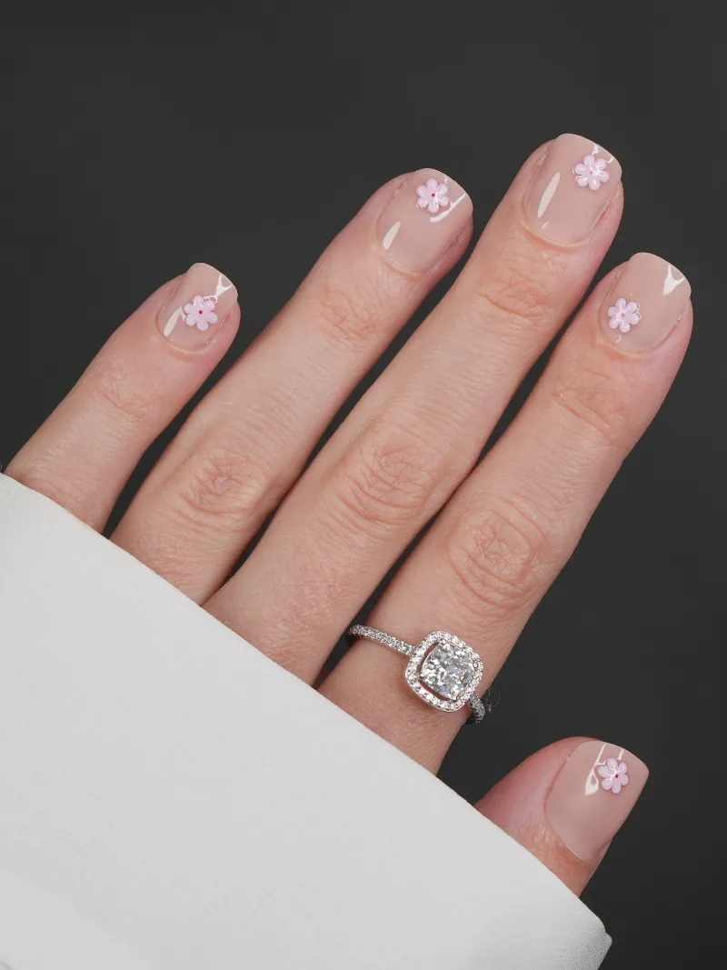 Roxy Nails Paris Sakura press-on nails with raised pink floral details on nude base