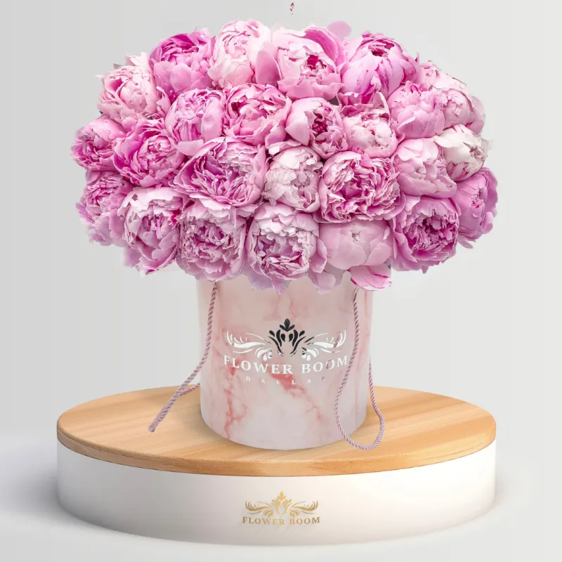 Flower Boom Dallas Peony Land arrangement with fresh coral peonies in a bouquet