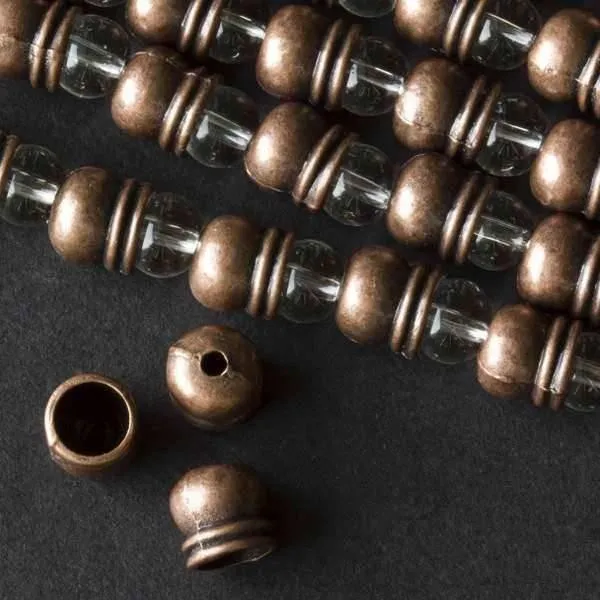 Cherry Tree Beads vintage copper colored 7x8mm smooth bead caps with a lip on an approx. 8 inch strand