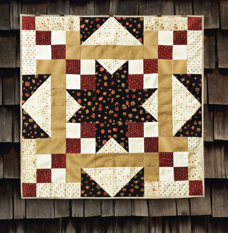 Boho Blanket Autumn Starburst Quilt Pattern, pattern cover with a starburst quilt design