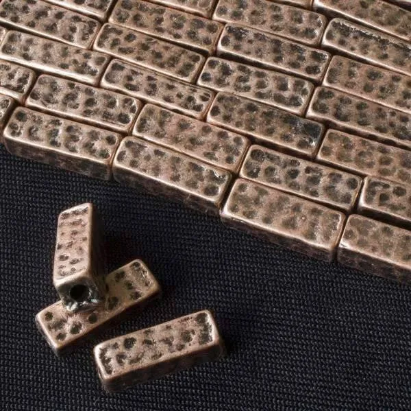 Cherry Tree Beads vintage copper colored 5x15mm hammered square tube beads on an approx. 8 inch strand