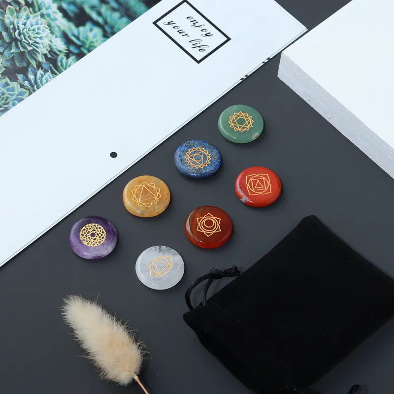Turix 7 Chakra Crystal Set with Engraved Chakra Symbols showing seven colorful gemstones with carved symbols