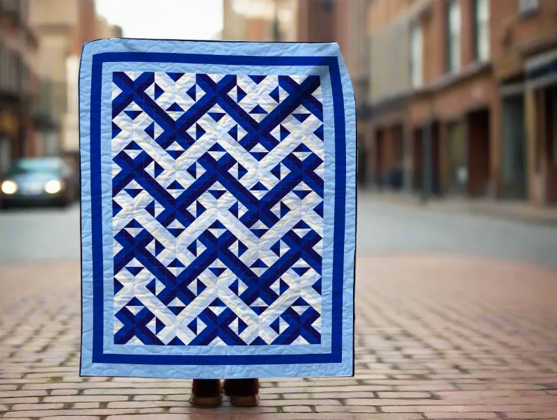 Boho Blanket Azure Symphony Quilt Pattern, a large blue quilt design shown finished