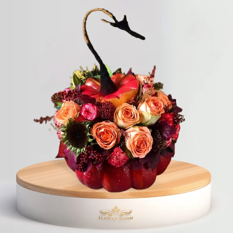 Flower Boom Dallas Mysterious Pumpkin arrangement with fresh fall flowers in a real pumpkin