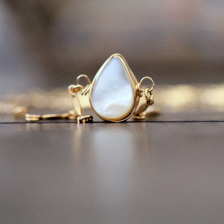 Spirit Nest Aya Choker necklace with mother of pearl teardrop pendant on scalloped chain