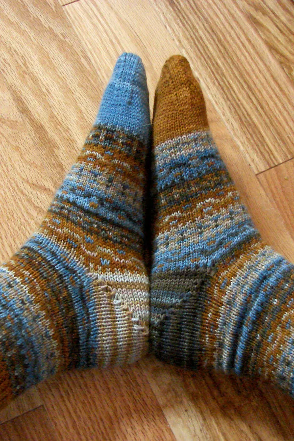 Kristen TenDyke Fraternal Socks knitting pattern showing Fair Isle colorwork in four shades of superwash merino