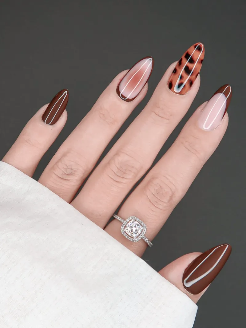 Roxy Nails Paris Auburn veil long almond nails with leopard print and brown French tips