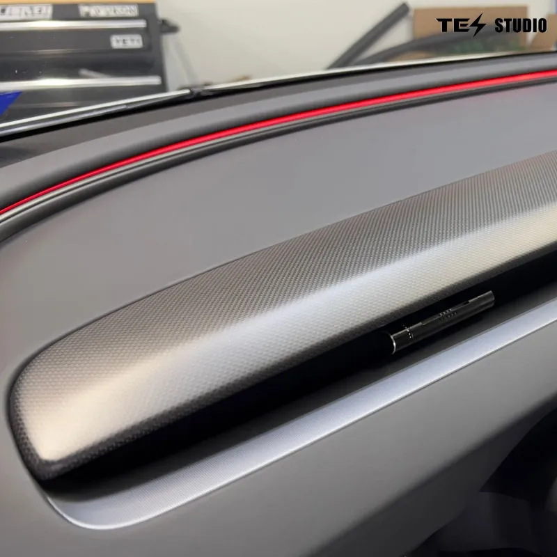 Tesstudio Carbon Fiber Dashboard Replacement for Model Y L showing full panel installed with continuous material finish across cockpit