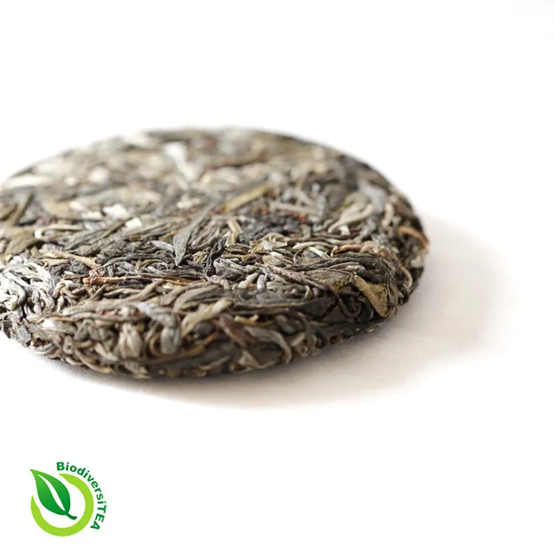 Wild Tea Qi Aged Rattan Qi Tea Ancient Tea Tree Artisanal Raw Puer Tea 2017 Limited Edition showing pressed tea cake