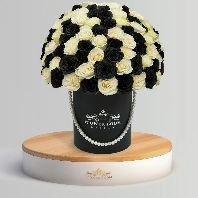 Flower Boom Dallas Chess Black And White Roses arrangement in a box