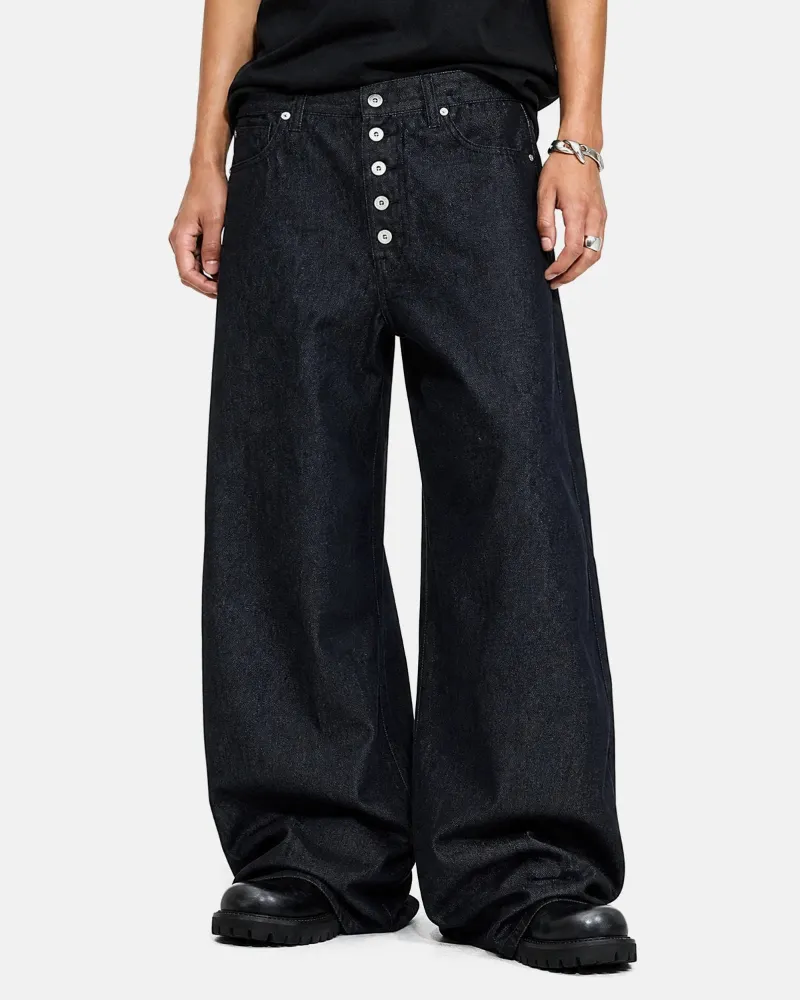 INFLATION Buttons Up Raw Baggy Jeans in black raw denim with button fly and wide-leg streetwear fit