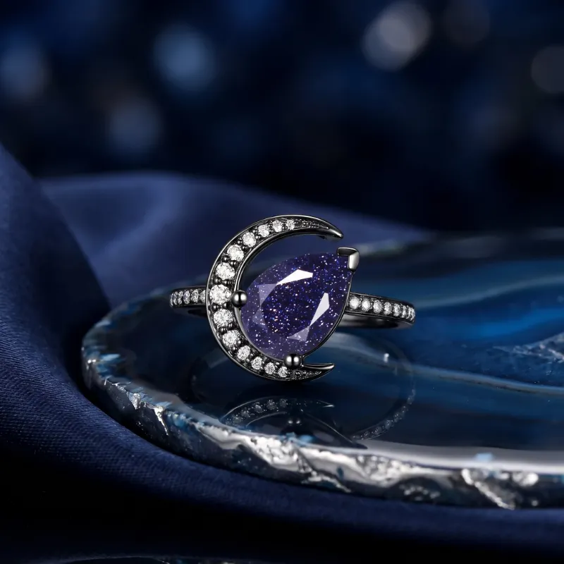 Starlandus Moonlit Reverie tilted pear blue sandstone crescent moon engagement ring