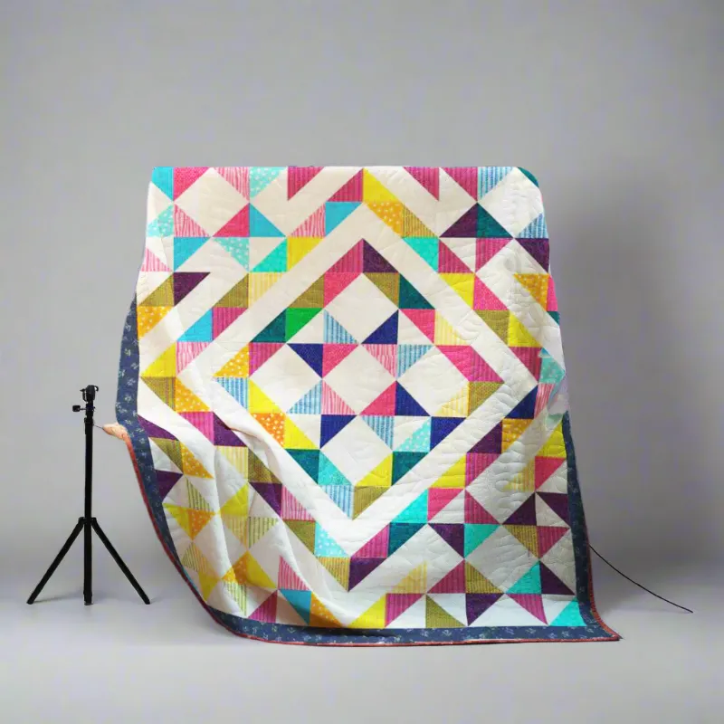Boho Blanket Central Star Radiance Quilt Pattern, a star-centered quilt in multiple bed sizes